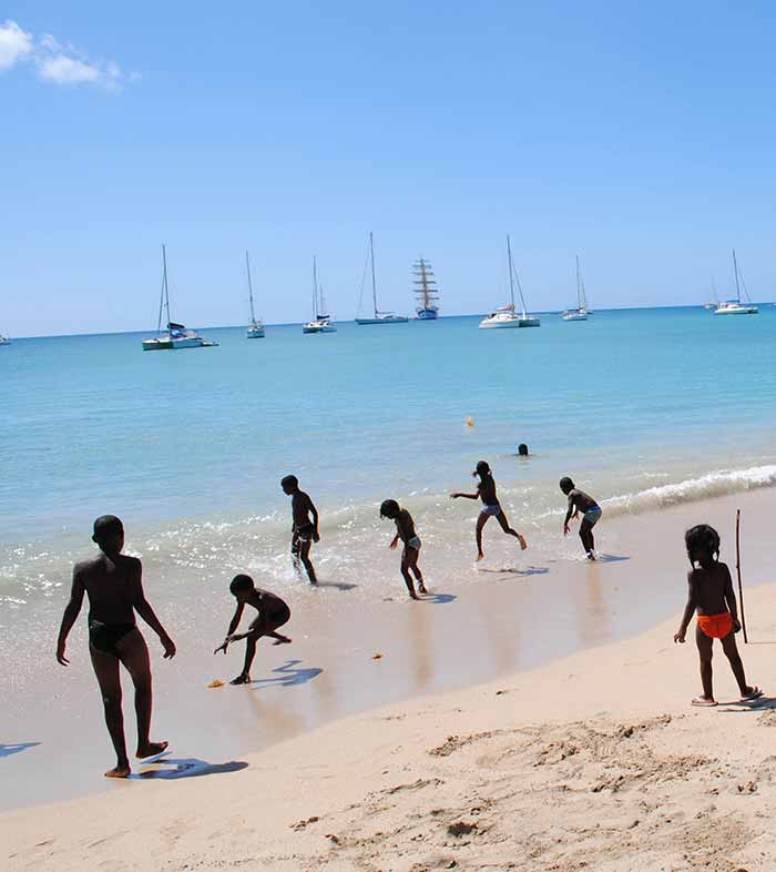 Children playing on beach, Rodney Bay, St. Lucia