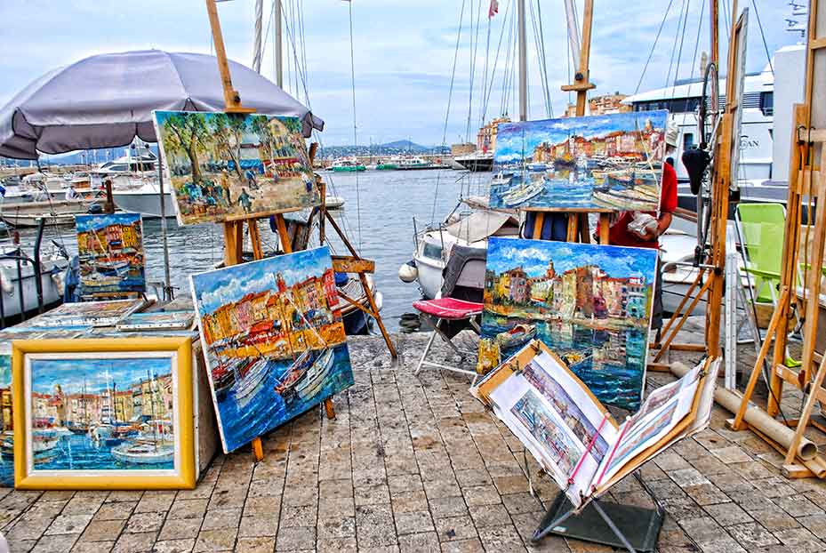 Artists on waterfront, St. Tropez, France