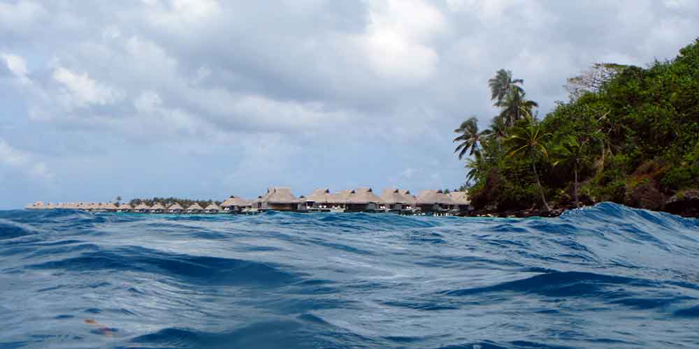 Overwater bungalows in the distance