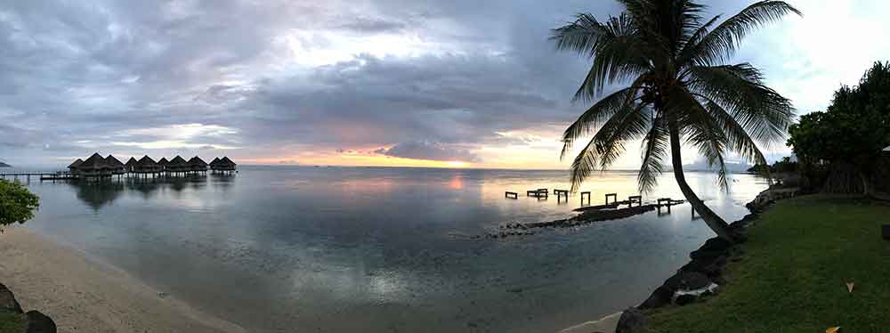 A panoramic shot of sunset from the beach at Le Meridien Tahiti.