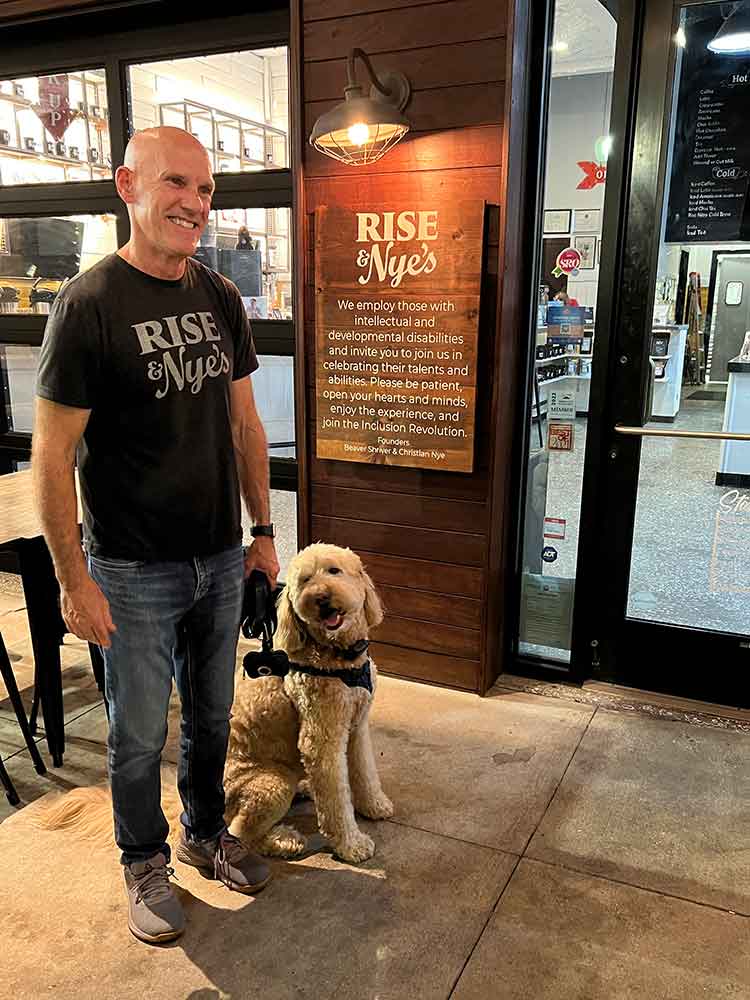 Beaver Shriver and dog outside Rise & Nye's