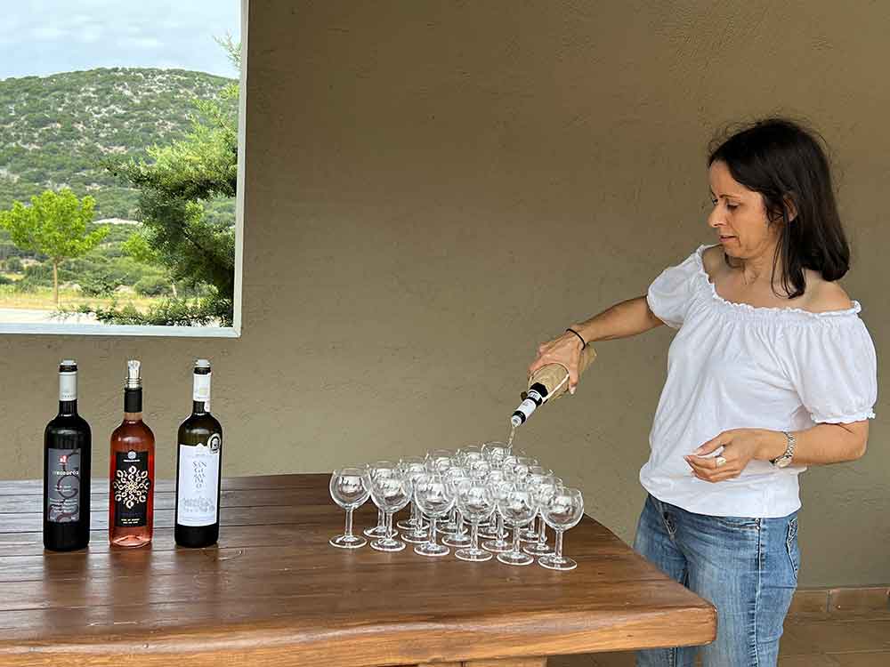 Pouring wine at Robola Winery, Argostoli, Greece