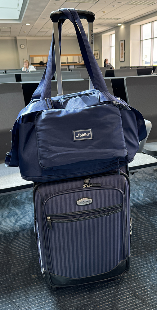 Suitcase with the Foldie® Travel Bag in the airport