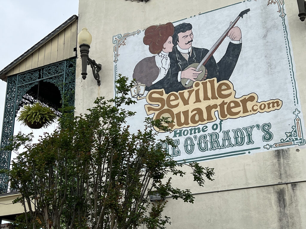 Seville Quarter.com sign on wall outside entrance 